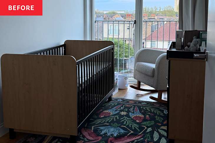 Nursery with a wooden crib, a rocking chair, and a colorful floral rug, featuring a balcony view.