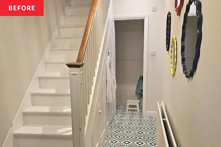 Graphic tile in hallway with white stairs before renovating.