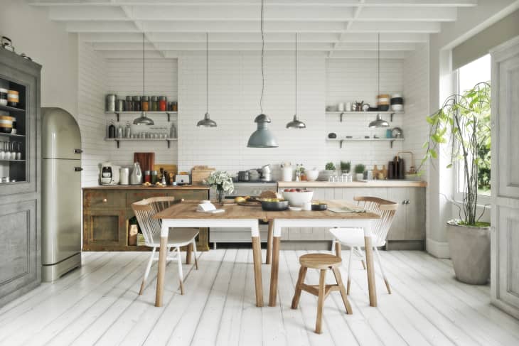 Scandinavian contemporary style kitchen with eating area and simplistic accents