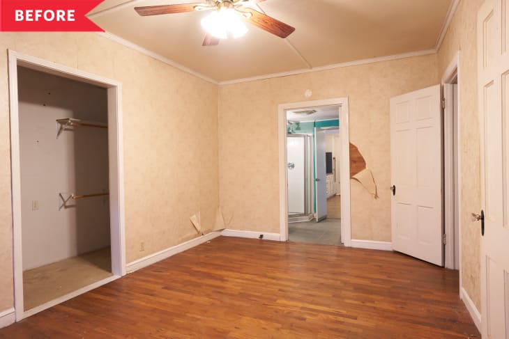 Empty room with hardwood floors, beige walls, ceiling fan, open closet, and visible damage near doorways.