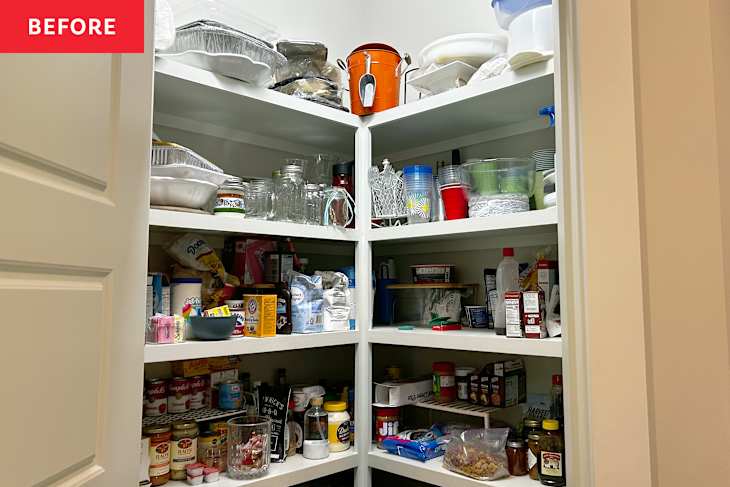 Cluttered pantry with various food items, jars, and containers on white shelves, including snacks and cooking supplies.