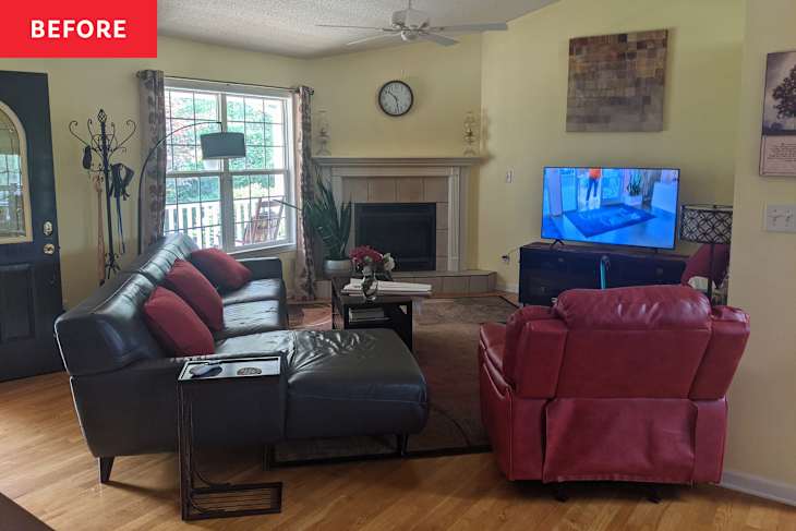 Living room with a dark sectional sofa, red accent pillows, a red recliner, and a TV on a stand near a fireplace.