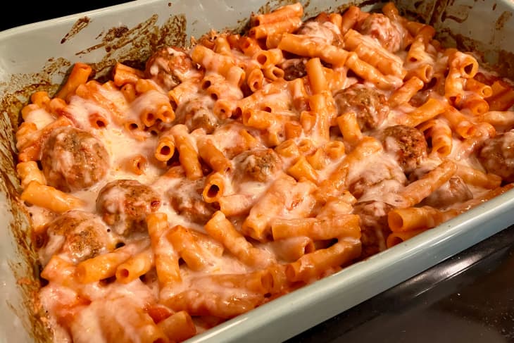 Casserole dish with Dump and Bake Meatloaf Casserole (meatballs, macaroni, red sauce)