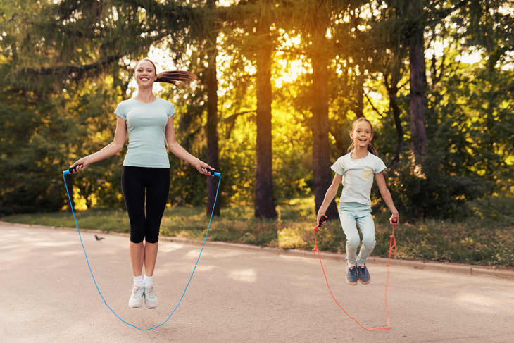 mother and daughter jumping rope
