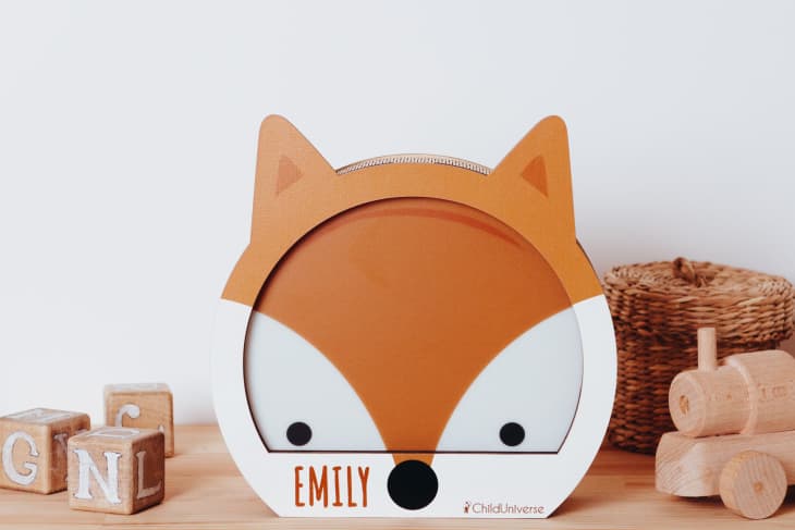 Fox nightlight on a shelf with blocks and a basket of toys