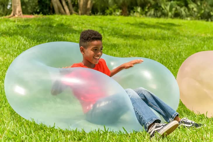 Kid playing with Wubble ball