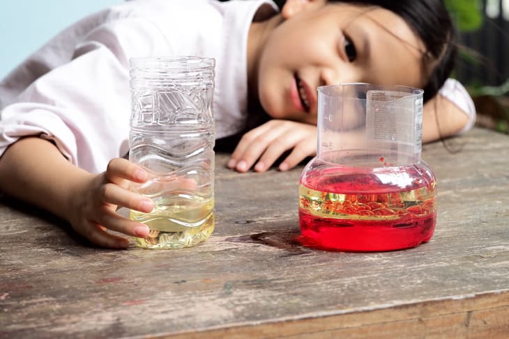young girl conducting STEAM experiment