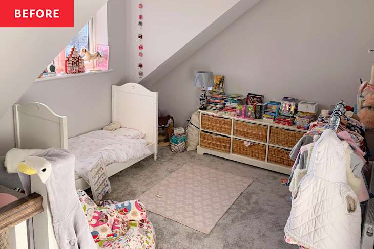 A cozy children's bedroom with a white bed, colorful books, a lamp, and a clothing rack.