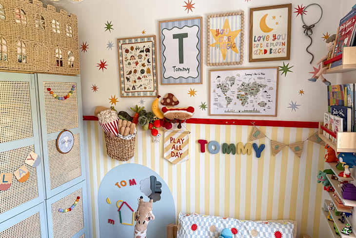 Colorful children's room featuring wall art, a toy storage unit, and playful decor items like plush food toys.