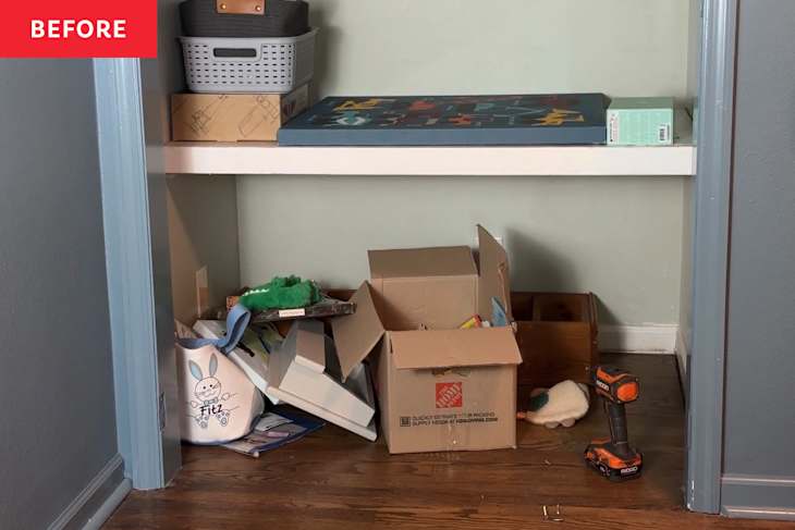 Boxes and clutter in closet nook before renovation.