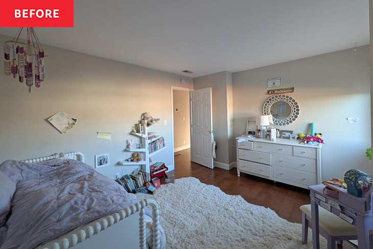 A cozy bedroom featuring a white bed with a lavender blanket, a bookshelf filled with books, and a white dresser with a mirror.
