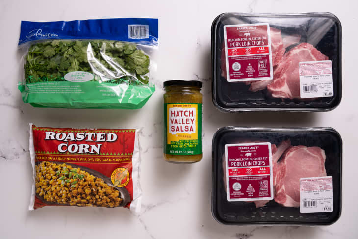 two packages of pork chops with bag of cilantro, roasted corn, and bottle of hatch valley salsa