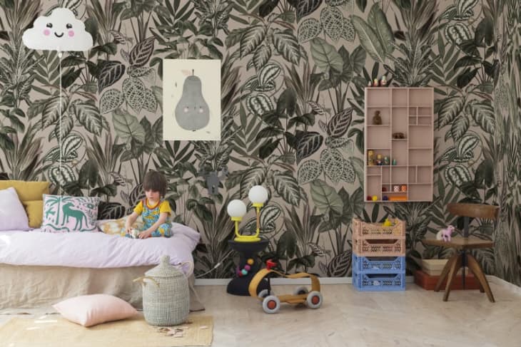 bold botanical wallpaper in a kid's room