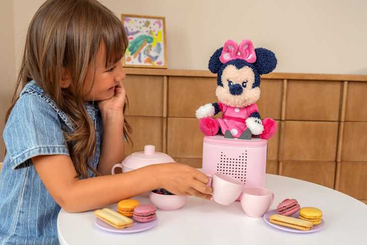 Child playing with Minnie Tonie.