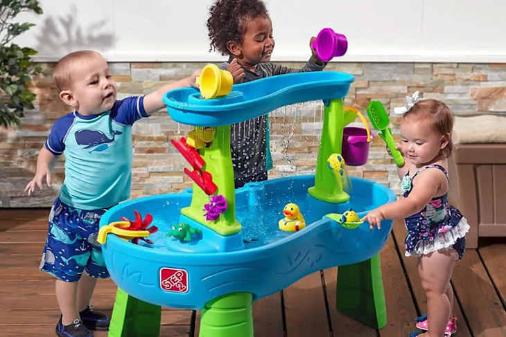 Kids playing with water table.