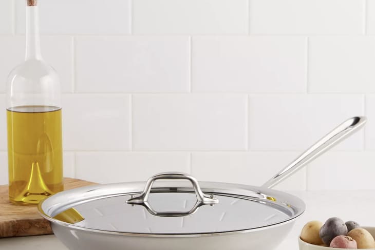 stainless steel frying pan on counter by olive oil