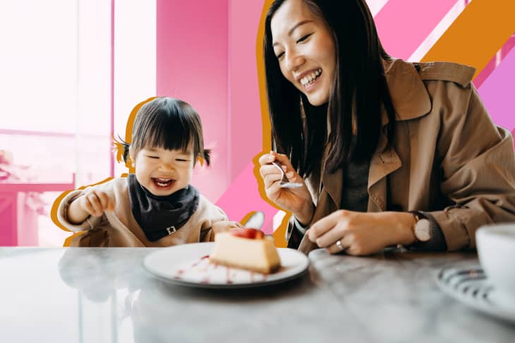 mom and toddler eating cake at dining table