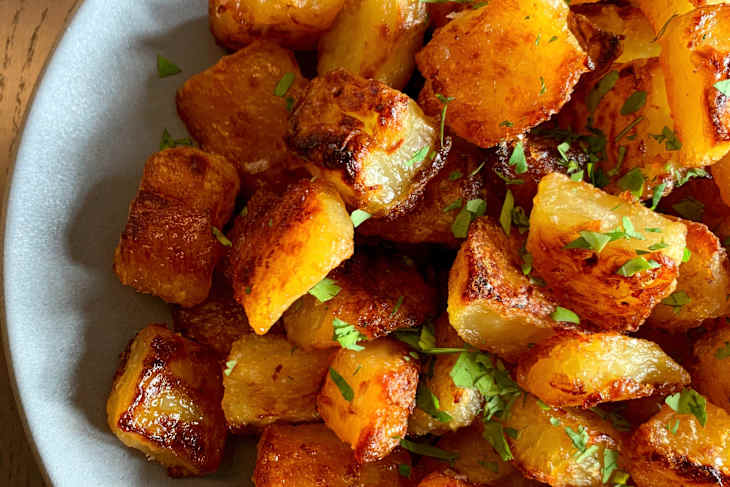 A bowl of roasted potatoes.