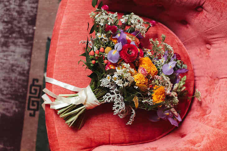 Wedding bouquet on armchair.