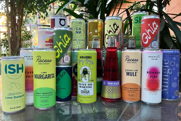 Group of a variety of canned mocktails on table outdoors