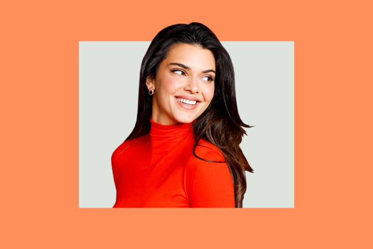 Kendall Jenner in red dress on colorful background