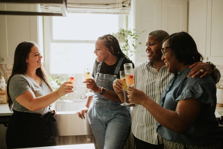 family drinking mimosas together at home