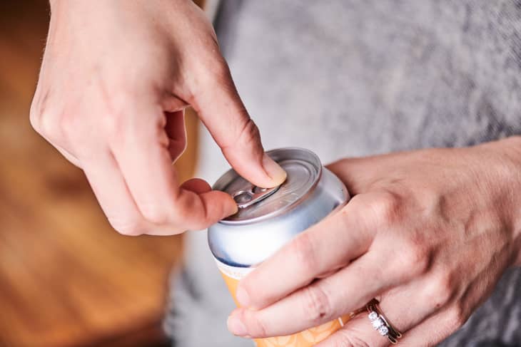 Opening a can of beer