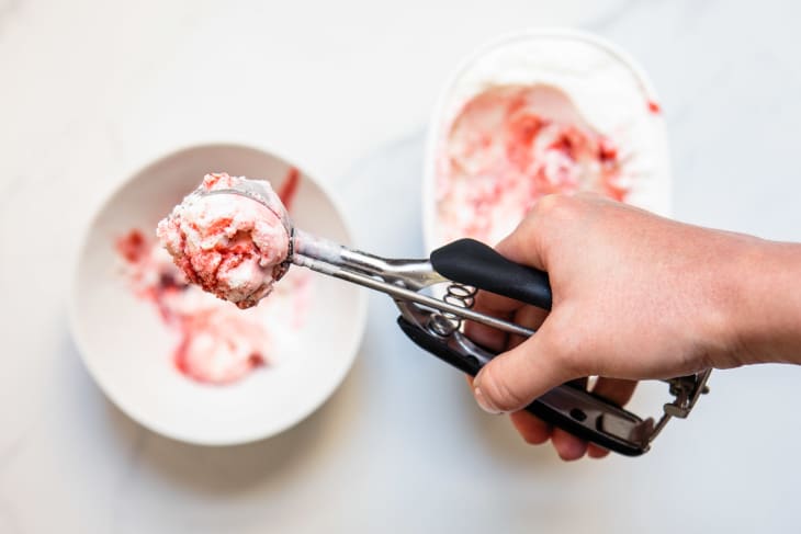 Scooping ice cream into a bowl with an OXO scooper