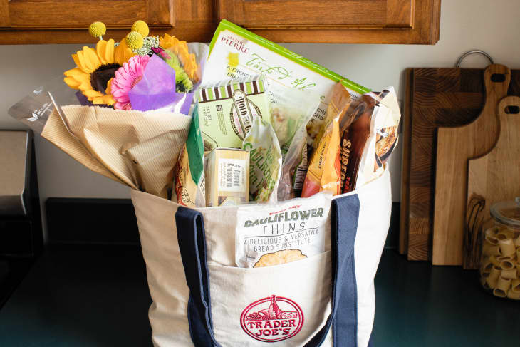 Large canvas bag filled with Trader Joe's groceries.