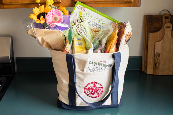 Trader Joe's groceries in canvas bag on kitchen counter.
