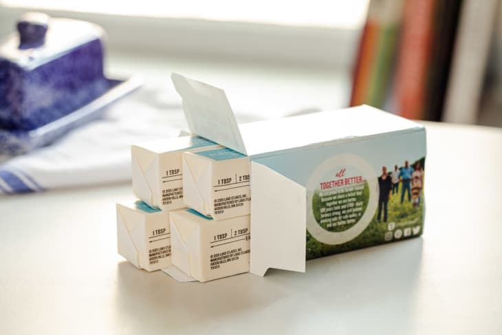 Cardboard carton of butter sticks.