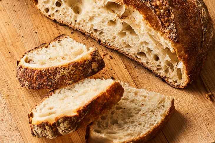 Sourdough loaf sliced in half and then into slices