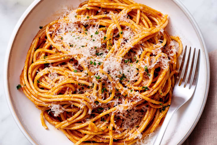 Caramelized tomato paste pasta plated.