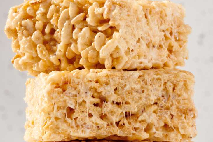 stack of three rice krispy treats on a marble surface
