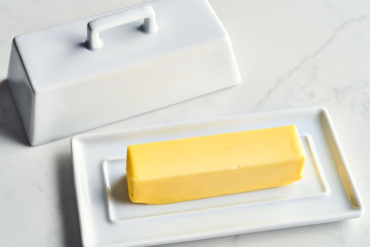 butter in a ceramic storage plate with lid next to it