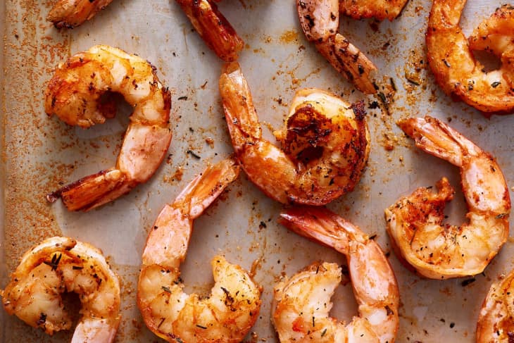 Cooked shrimp on a baking sheet
