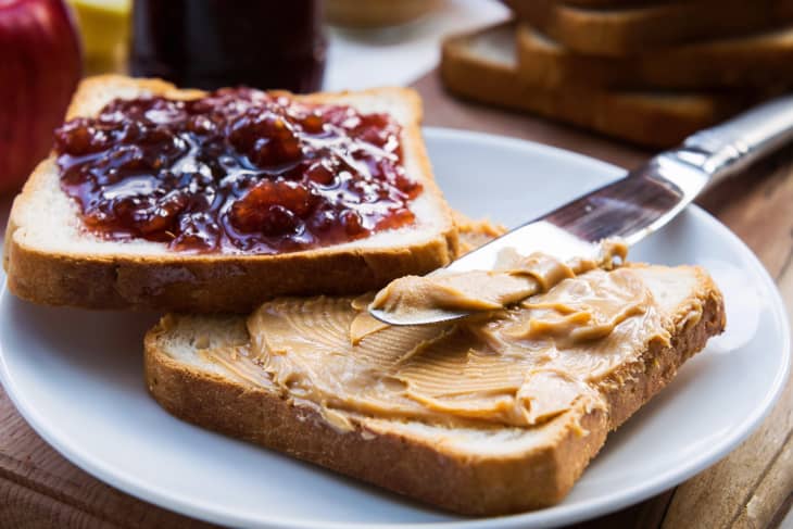two pieces of bread with peanut butter and jelly on them
