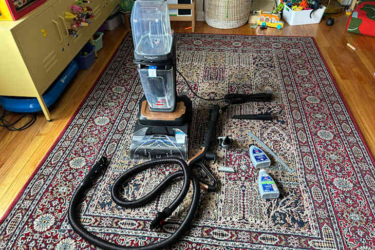 Bissell hydrosteam vacuum on rug.