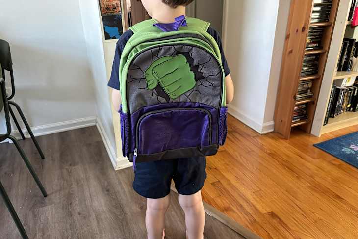 Child wearing Pottery Barn MacKenzie backpack.