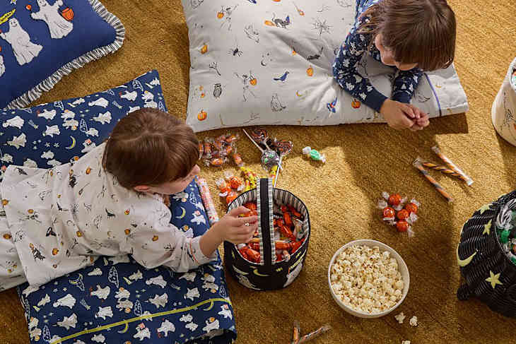 Kids enjoying Halloween candy.