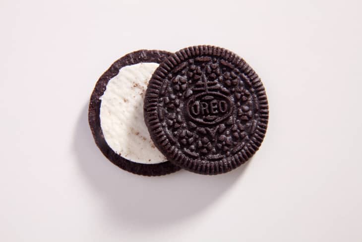 oreo cookie partly open on white background