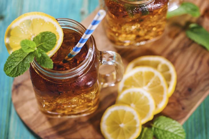 Freshly made ice tea with lemon and mint in a jar