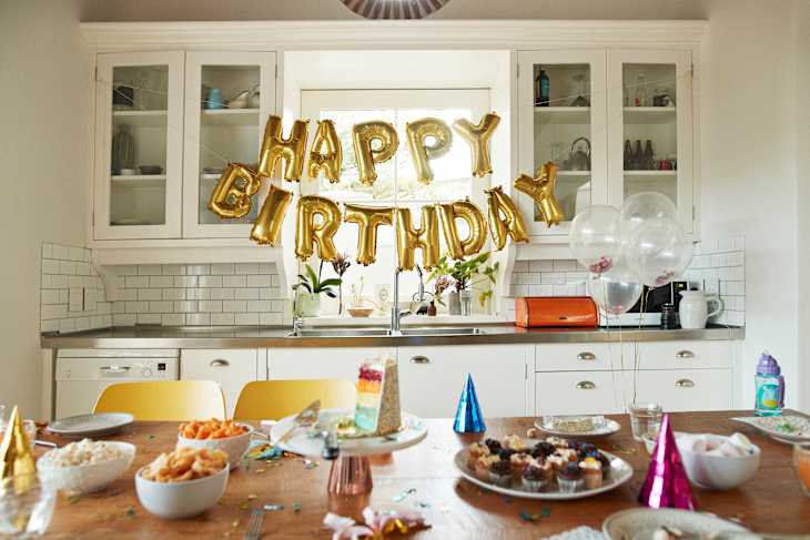 Various dessert on table during birthday party at home