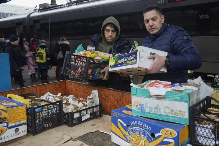 Volunteers unload products and food at the train station on March 1, 2022 in Kyiv, Ukraine.