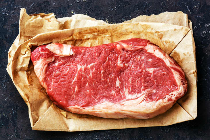Raw fresh meat steak on kraft paper