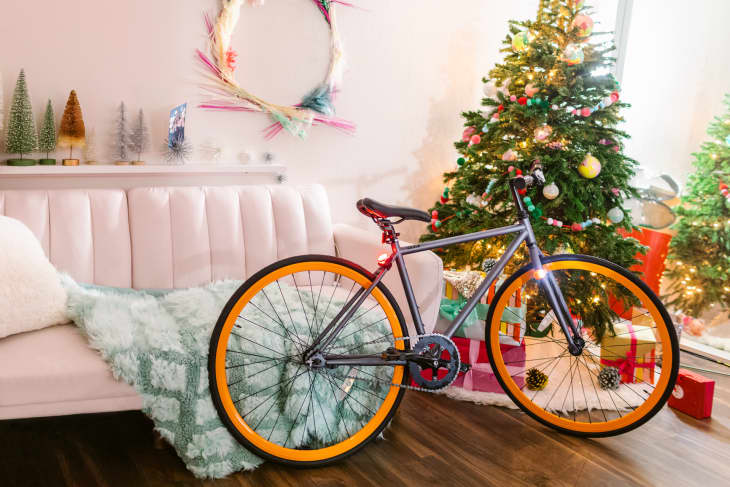 bicycle in room in front of christmas tree