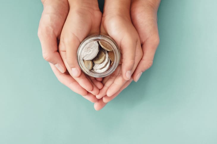 child and parent hands holding money jar, donation, saving, charity, family finance plan concept, Coronavirus economic stimulus rescue package, superannuation concept.