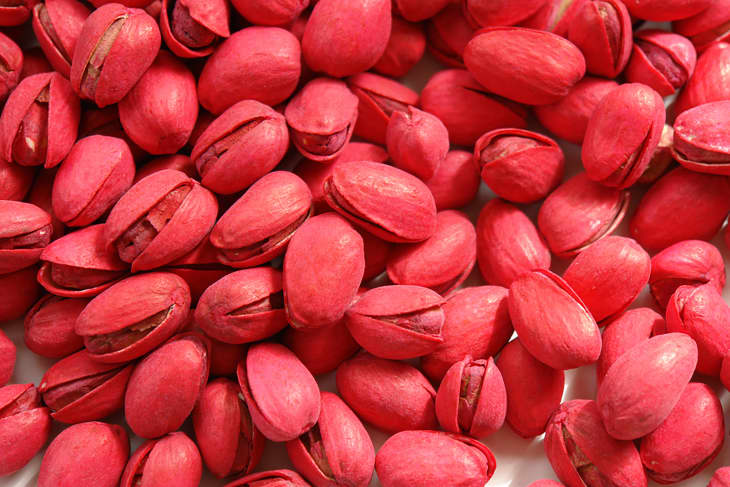 Red pistachios on a white background