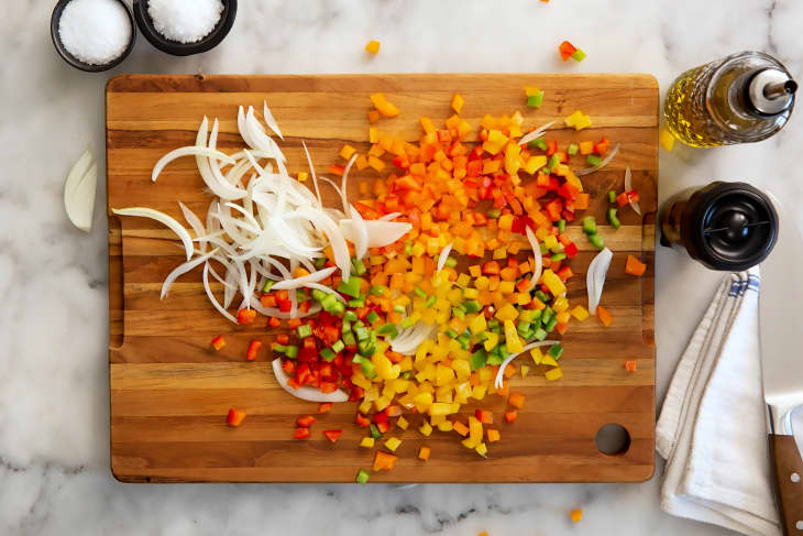 Colorful chopped vegetables spread across a cutting board