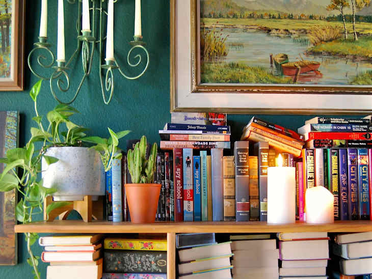 Bookshelf overflowing with books.